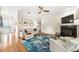 Comfortable living room with hardwood floors, fireplace, and neutral-toned furniture, creating a relaxing atmosphere at 1420 Palmer Ave, Winter Park, FL 32789