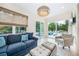 Bright sunroom with a view of the private pool, a ceiling fan, and stylish furnishings at 1420 Palmer Ave, Winter Park, FL 32789