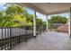 Large balcony with black metal railings and slate flooring, providing a private outdoor space at 1429 Arbitus Cir, Oviedo, FL 32765