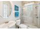 Bright bathroom with a glass-enclosed shower, vanity, and modern fixtures, providing a clean and functional space at 1429 Arbitus Cir, Oviedo, FL 32765