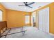Bright bedroom features a ceiling fan, double door closet and connecting bathroom at 1429 Arbitus Cir, Oviedo, FL 32765