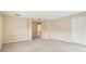 Large bedroom with neutral carpet, white trim and access to the hallway and closet at 1429 Arbitus Cir, Oviedo, FL 32765