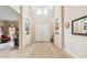 Grand foyer with soaring ceilings, tiled floors, and arched doorways at 1429 Arbitus Cir, Oviedo, FL 32765