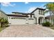 Charming two-story home with three-car garage and brick paved driveway at 1429 Arbitus Cir, Oviedo, FL 32765