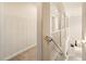 Bright hallway with white railing, arches, and beige walls leading to a living space at 1429 Arbitus Cir, Oviedo, FL 32765