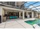 Inviting outdoor oasis features an outdoor kitchen, covered seating area, and a sparkling in-ground pool at 1429 Arbitus Cir, Oviedo, FL 32765