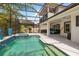 Relax in this screened-in pool and spa with beautiful backyard views at 1429 Arbitus Cir, Oviedo, FL 32765
