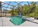 Enjoy this private screened-in pool and spa, surrounded by lush landscaping at 1429 Arbitus Cir, Oviedo, FL 32765