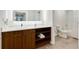 The modern bathroom offers a sleek vanity, ample storage, and a combination tub-shower with elegant fixtures at 14501 Grove Resort Ave # 2451, Winter Garden, FL 34787