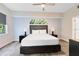 Comfortable bedroom featuring a queen-size bed, stylish decor, and a window offering natural light at 14501 Grove Resort Ave # 2451, Winter Garden, FL 34787