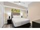 This bedroom features a plush bed, modern decor, and a relaxing ambiance with contemporary accents at 14501 Grove Resort Ave # 2451, Winter Garden, FL 34787