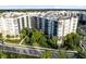 Beautiful condo building with lush landscaping and well-maintained grounds in a desirable community at 14501 Grove Resort Ave # 2451, Winter Garden, FL 34787