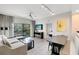 Bright living room featuring modern furniture, a ceiling fan, and a private balcony with outdoor seating at 14501 Grove Resort Ave # 2451, Winter Garden, FL 34787