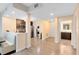 Open-concept living space with modern kitchen, stainless steel appliances, and convenient laundry area at 14501 Grove Resort Ave # 2451, Winter Garden, FL 34787