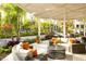 The covered patio includes comfortable seating arrangements and lush landscaping, offering a relaxing outdoor space at 14501 Grove Resort Ave # 2451, Winter Garden, FL 34787