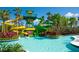 Thrilling waterpark featuring vibrant slides, lush landscaping, and a refreshing lazy river at 14501 Grove Resort Ave # 2451, Winter Garden, FL 34787
