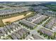 An aerial view of a Primary-planned community with single-Gathering homes, lakes, and green spaces at 15096 Chapter Way, Winter Garden, FL 34787