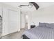 This bedroom includes a closet, neutral walls, modern ceiling fan and an open doorway to the other rooms at 15096 Chapter Way, Winter Garden, FL 34787