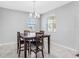 Bright dining area featuring a chandelier and large windows for natural light at 15096 Chapter Way, Winter Garden, FL 34787
