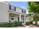 Charming two-story home with a covered front porch, manicured landscaping, and tasteful curb appeal at 15096 Chapter Way, Winter Garden, FL 34787