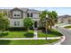 Charming two-story home featuring a well-maintained lawn and inviting landscaping, offering great curb appeal at 15096 Chapter Way, Winter Garden, FL 34787