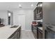 Modern kitchen featuring stainless steel appliances, a center island, and sleek cabinetry in an open layout at 15096 Chapter Way, Winter Garden, FL 34787