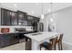 Modern kitchen featuring stainless steel appliances, a center island, and sleek cabinetry in an open layout at 15096 Chapter Way, Winter Garden, FL 34787