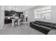 Modern kitchen featuring stainless steel appliances, a center island, and sleek cabinetry in an open layout at 15096 Chapter Way, Winter Garden, FL 34787