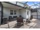 Comfortable seating on a screened patio with brick flooring, and a partial view of the house and backyard at 15096 Chapter Way, Winter Garden, FL 34787