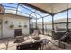 Relaxing screened patio with brick pavers and comfortable seating arrangement perfect for outdoor living at 15096 Chapter Way, Winter Garden, FL 34787