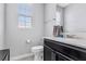 A well-lit half bathroom featuring a vanity and toilet at 15096 Chapter Way, Winter Garden, FL 34787