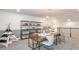 Bright home office space with shelving and a shared workspace at 16352 Crown Top Dr, Montverde, FL 34756