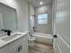 Bathroom featuring tile surround, modern vanity, and tile floors at 16463 Sw 55Th Court Rd, Ocala, FL 34473