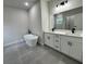 Modern bathroom with a soaking tub, dual sinks, and stylish tile flooring at 16463 Sw 55Th Court Rd, Ocala, FL 34473