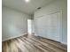 Bedroom featuring wood floors and a closet at 16463 Sw 55Th Court Rd, Ocala, FL 34473