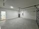 View of the garage with an automatic door opener and plenty of room for storage at 16463 Sw 55Th Court Rd, Ocala, FL 34473