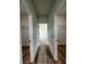 Hallway with wood-look flooring, leading to bedrooms with closet space at 16463 Sw 55Th Court Rd, Ocala, FL 34473