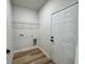 This is a laundry room with a wire shelf and connections for a washer and dryer at 16463 Sw 55Th Court Rd, Ocala, FL 34473
