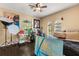 Bright bedroom with dark wood floors, ceiling fan, arched windows and unique decorative art at 173 Villa Di Este Ter # 209, Lake Mary, FL 32746
