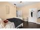 Bedroom features dark hardwood floors, natural light and dark comforter with matching pillows at 173 Villa Di Este Ter # 209, Lake Mary, FL 32746