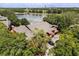 Beautiful home with lush landscaping and mature trees backing to a calm lake at 173 Villa Di Este Ter # 209, Lake Mary, FL 32746