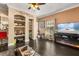 Open living room with hardwood floors, built-in shelving, fireplace and neutral tones at 173 Villa Di Este Ter # 209, Lake Mary, FL 32746