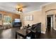 Inviting living room with dark floors, fan, and decorative fireplace, creating a cozy ambiance at 173 Villa Di Este Ter # 209, Lake Mary, FL 32746