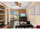 Inviting living room with dark floors, fan, and decorative fireplace, creating a cozy ambiance at 173 Villa Di Este Ter # 209, Lake Mary, FL 32746