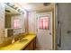 Vintage bathroom with vanity, light fixtures, and shower at 203 N Forest Blvd, Lake Mary, FL 32746
