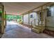 Spacious carport leads to a home entrance with landscaped borders, offering convenience and curb appeal at 203 N Forest Blvd, Lake Mary, FL 32746