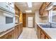 Well-equipped kitchen with wood cabinets, a full appliance set, and ample counter space for convenient cooking at 203 N Forest Blvd, Lake Mary, FL 32746