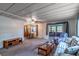 Open concept living room with ceiling fan, leading to screened in porch at 203 N Forest Blvd, Lake Mary, FL 32746