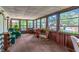 Sunroom with multiple windows providing ample light and views of the outdoor scenery at 203 N Forest Blvd, Lake Mary, FL 32746