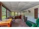 Relaxing sunroom with views of the outdoors and lots of natural light at 203 N Forest Blvd, Lake Mary, FL 32746